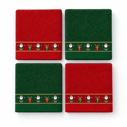 Quatro panos de cozinha Pai Natal dobrados, em vermelho e verde, com faixa natalícia de Pais Natais e presentes.